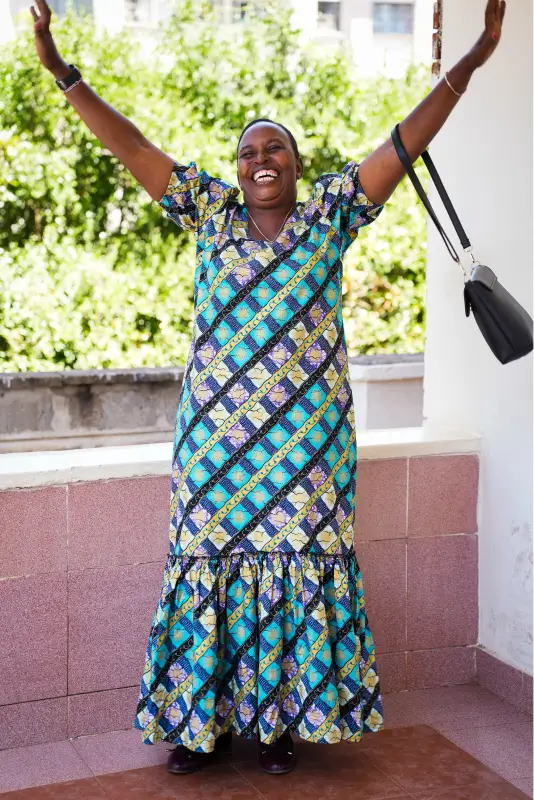 excited woman in a dress with a handbag