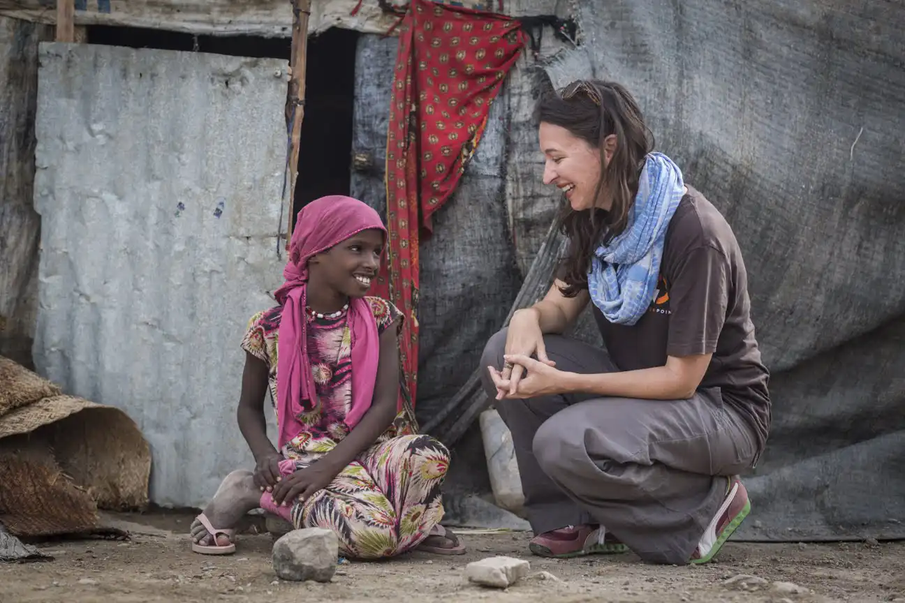 woman meeting with Ethiopian child