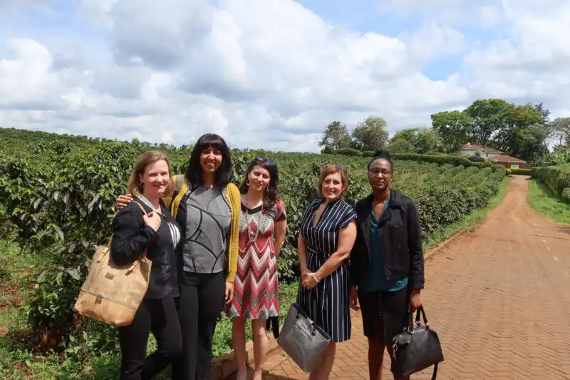 group photo in front of crops