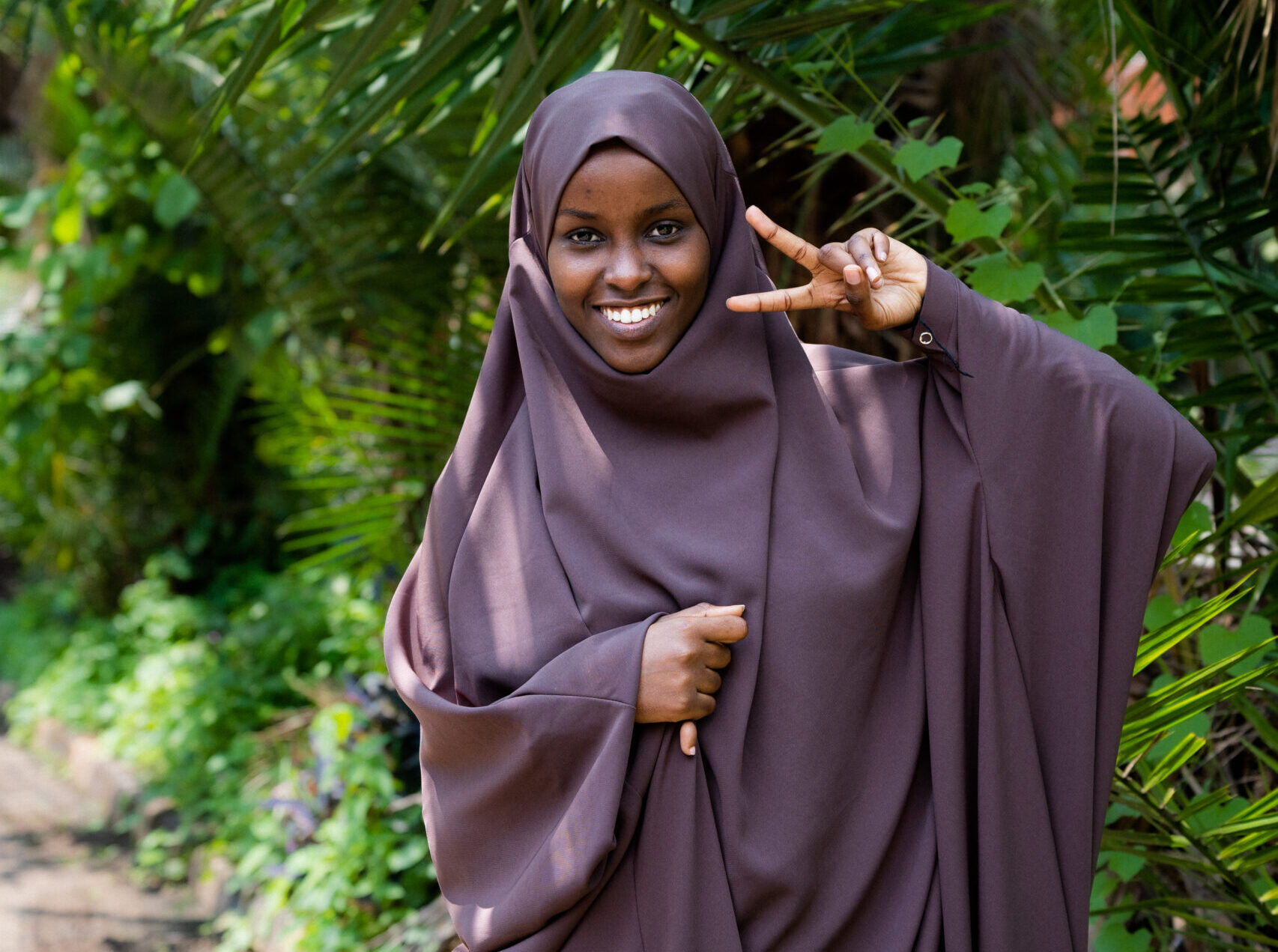 woman giving the peace sign