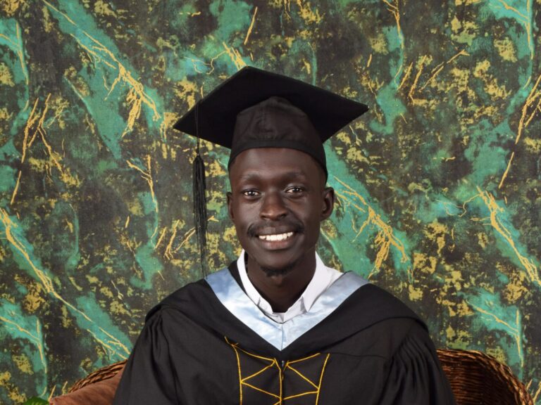 man with graduation cap and gown on