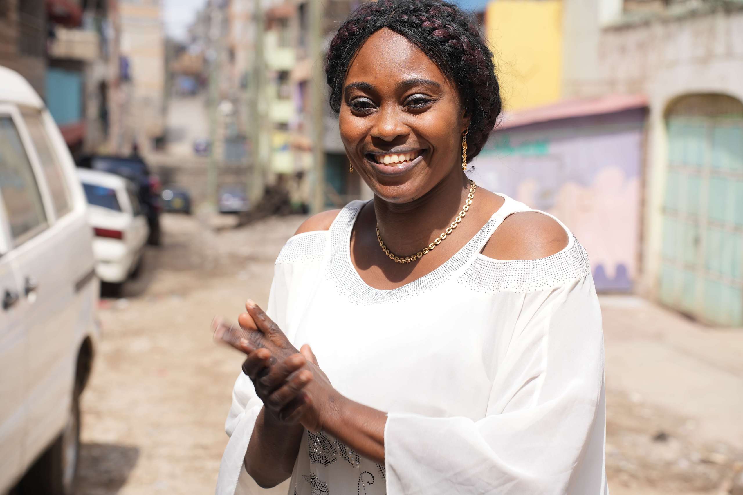 woman dressed in white smiling